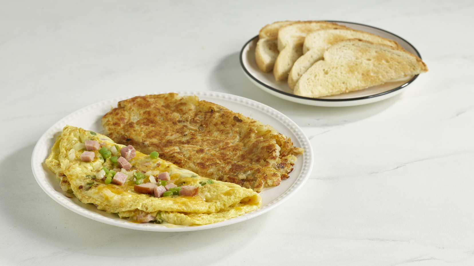 Denver Omelette with ham, peppers, onions, cheddar cheese and hash browns